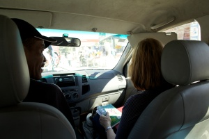 Dr. McGrath gets creole lessons from our driver on our way out of Port au Prince.